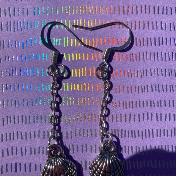 Long dangling earrings in a sea shell shape. - Picture 4 of 7